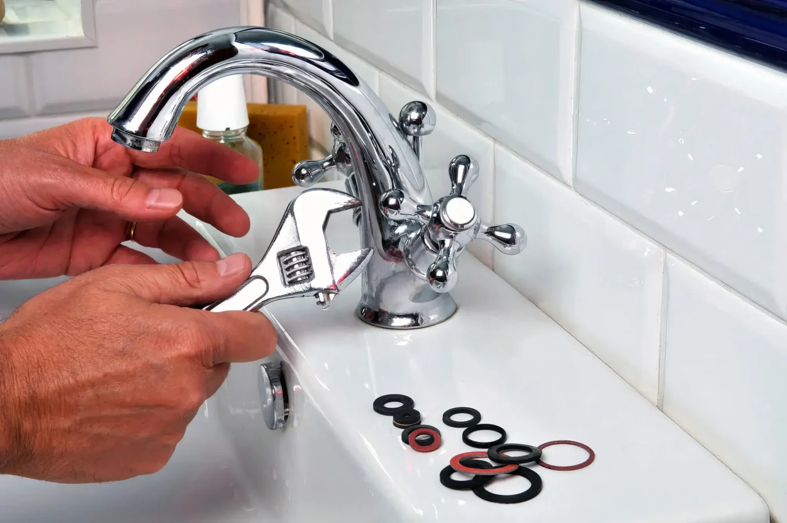 Plumber maintaining a bathroom faucet in Costa Mesa