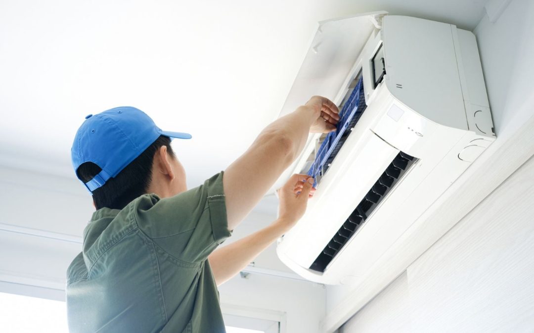 HVAC technician servicing a ductless mini split in Costa Mesa
